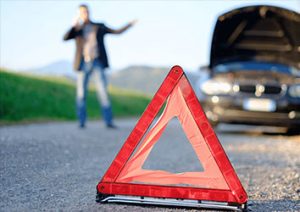 A red triangle on the side of a road.