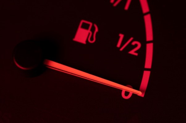 A close up of the gas guage in a car